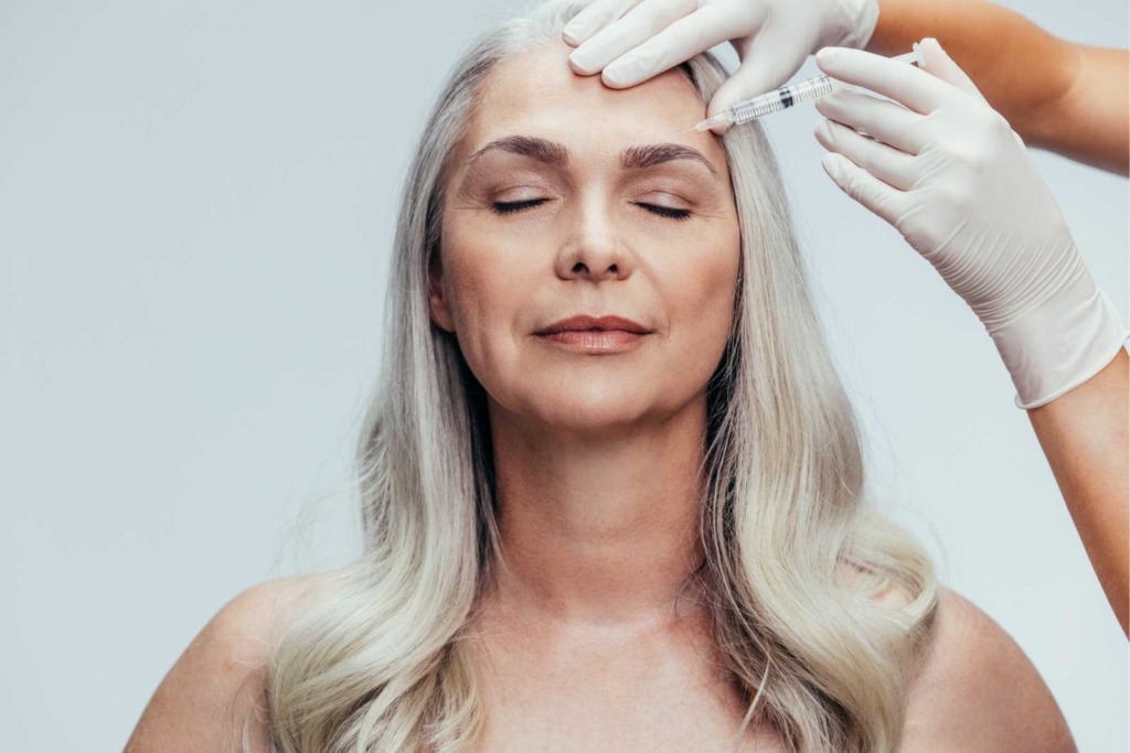 Older woman receiving botox for lines and wrinkles