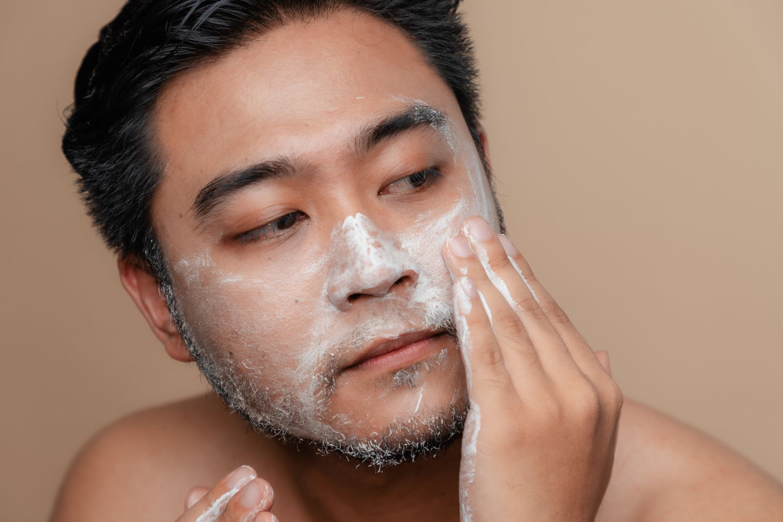Guy using Cleanser for his face