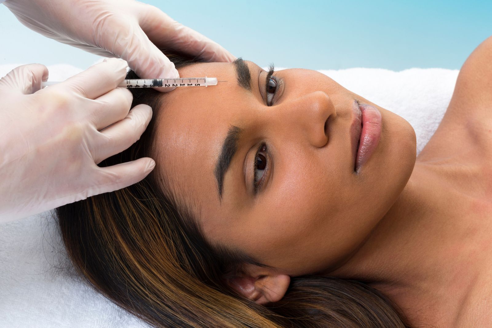 Mixed Race Woman Receiving Botox Injection