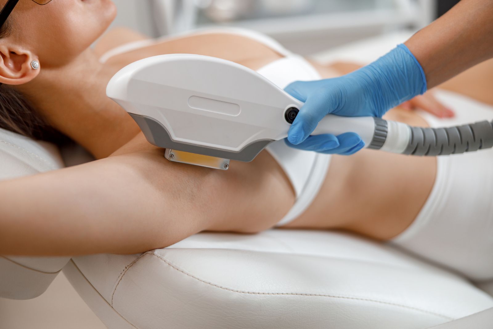 Closeup of Armpit Hair Laser Removal Procedure with Ipl Machine in a Beauty Salon