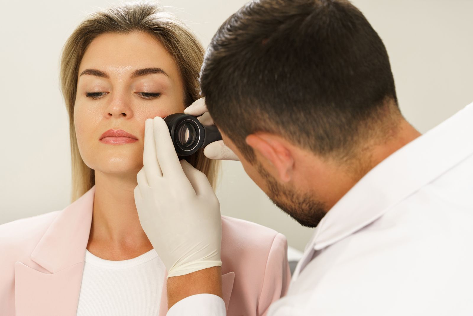 Dermatologist Is Using Dermatoscope for Facial Skin Examination